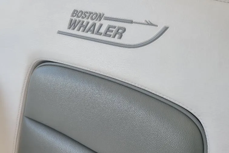 The Snapper Slapper Yacht Photos Pics Boston Whaler 315 Conquest Pilothouse 2014, embossed logo on boat seat upholstery.