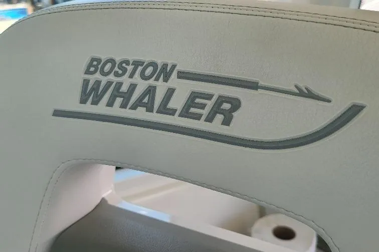 The Snapper Slapper Yacht Photos Pics Boston Whaler 315 Conquest Pilothouse 2014 logo on boat seat upholstery.