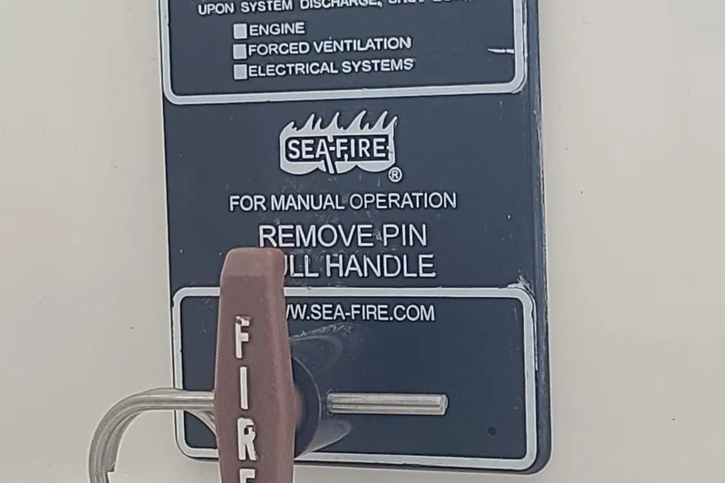 The Snapper Slapper Yacht Photos Pics Sea-Fire manual operation handle on 2014 Boston Whaler 315 Conquest Pilothouse.