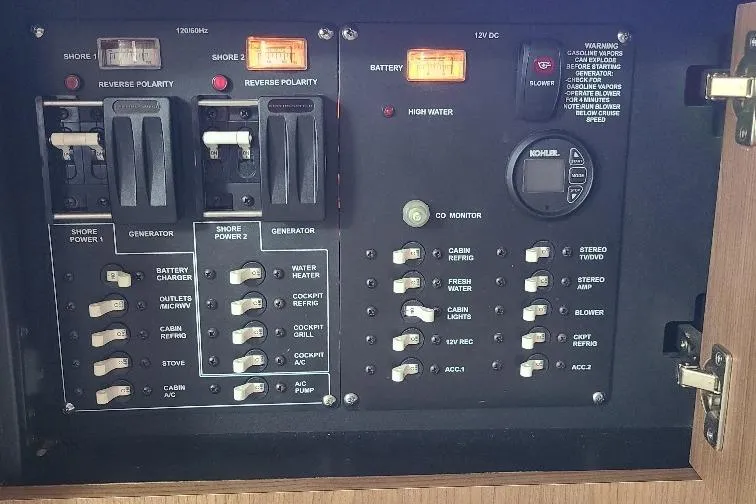 The Snapper Slapper Yacht Photos Pics Electrical control panel of a 2014 Boston Whaler 315 Conquest Pilothouse boat.
