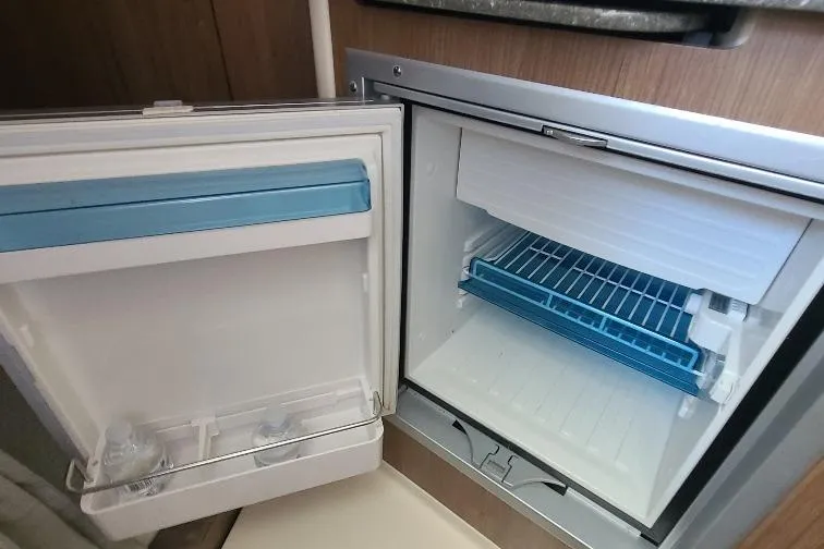 The Snapper Slapper Yacht Photos Pics Open mini fridge inside 2014 Boston Whaler 315 Conquest Pilothouse boat cabin.