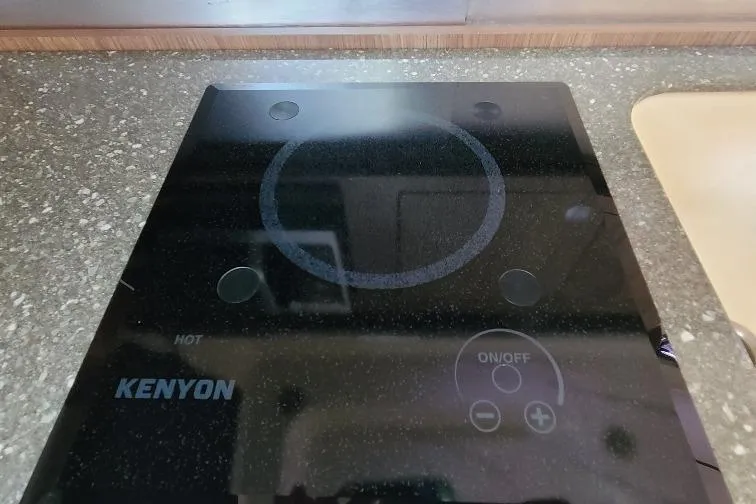 The Snapper Slapper Yacht Photos Pics Kenyon stove on 2014 Boston Whaler 315 Conquest Pilothouse kitchen counter.