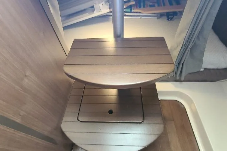 The Snapper Slapper Yacht Photos Pics Interior of 2014 Boston Whaler 315 Conquest Pilothouse with wooden steps and cozy cabin.