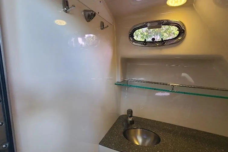 The Snapper Slapper Yacht Photos Pics 2014 Boston Whaler 315 Conquest Pilothouse interior with sink and window view.