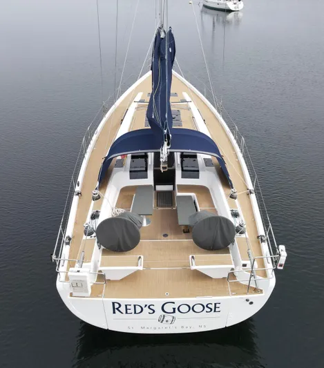 Red's Goose Yacht Photos Pics Hanse 575 yacht, 2016 model, named "Red's Goose" on calm water.