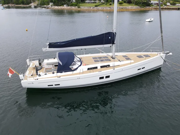 Red's Goose Yacht Photos Pics 2016 Hanse 575 yacht on calm water, featuring sleek design and spacious deck.