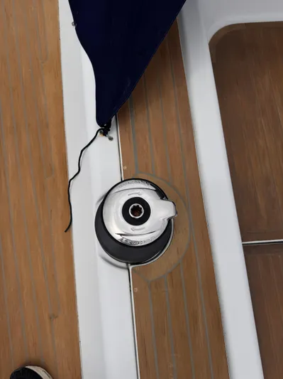 Red's Goose Yacht Photos Pics Winch on 2016 Hanse 575 yacht deck, featuring teak wood and stainless steel.
