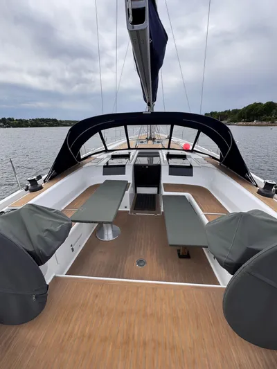 Red's Goose Yacht Photos Pics 2016 Hanse 575 yacht cockpit with seating, open water view, and overcast sky.