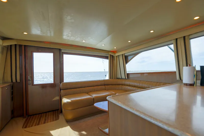 Beer-a-cuda Yacht Photos Pics Luxurious interior of 2005 Viking 48 Convertible yacht with ocean view.