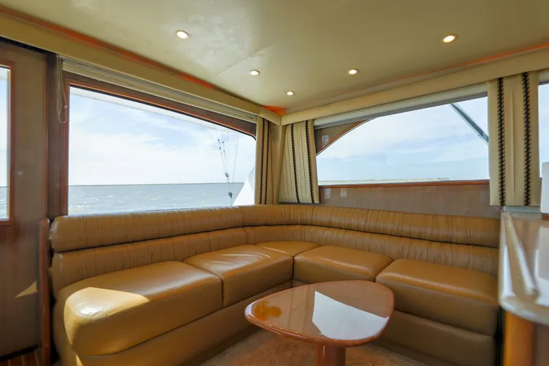 Beer-a-cuda Yacht Photos Pics Luxurious interior of 2005 Viking 48 Convertible yacht with ocean view.