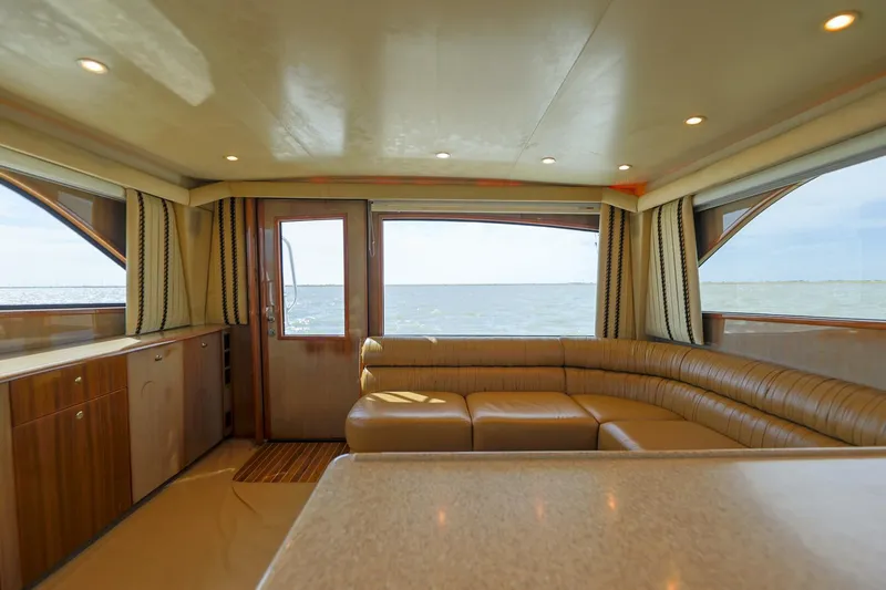 Beer-a-cuda Yacht Photos Pics Interior of 2005 Viking 48 Convertible yacht with ocean view and luxurious seating.