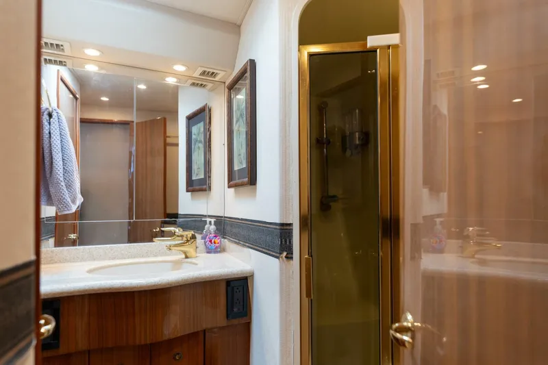 Beer-a-cuda Yacht Photos Pics Luxurious bathroom in 2005 Viking 48 Convertible yacht with shower and vanity.