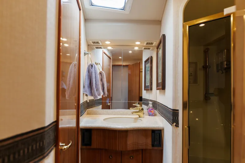 Beer-a-cuda Yacht Photos Pics Luxurious bathroom in 2005 Viking 48 Convertible yacht with elegant fixtures.