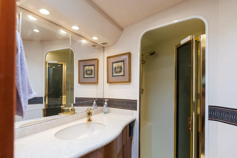 Beer-a-cuda Yacht Photos Pics Luxurious bathroom in 2005 Viking 48 Convertible yacht with shower and elegant decor.