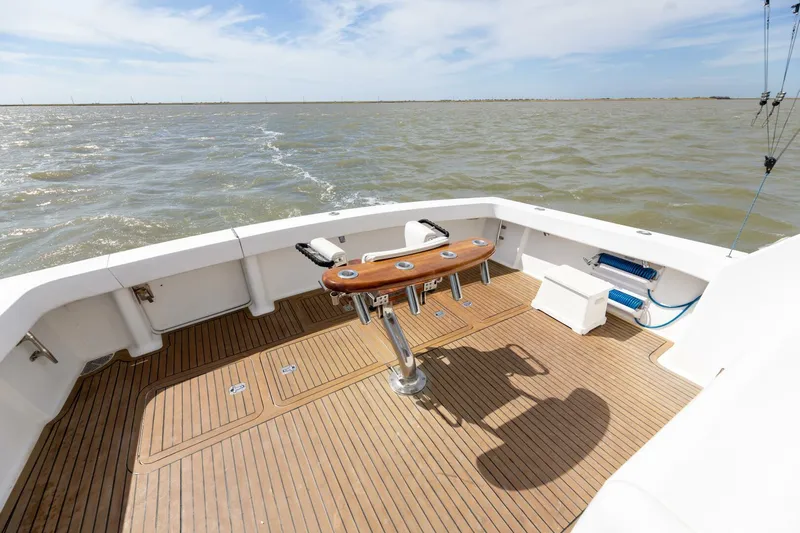 Beer-a-cuda Yacht Photos Pics 2005 Viking 48 Convertible yacht deck with ocean view and fishing setup.