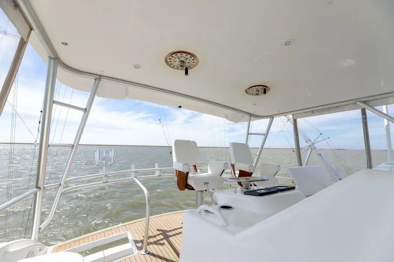 Beer-a-cuda Yacht Photos Pics Viking 48 Convertible 2005 yacht helm with ocean view and fishing rods.
