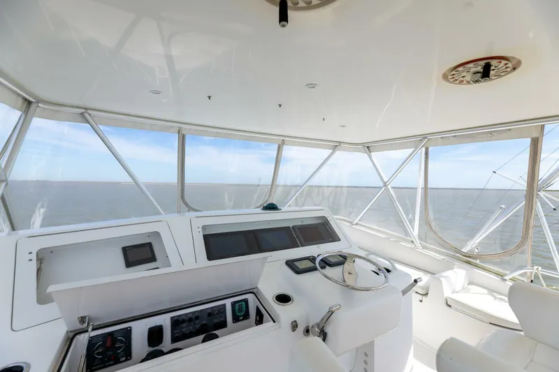 Beer-a-cuda Yacht Photos Pics 2005 Viking 48 Convertible yacht helm with ocean view and navigation controls.