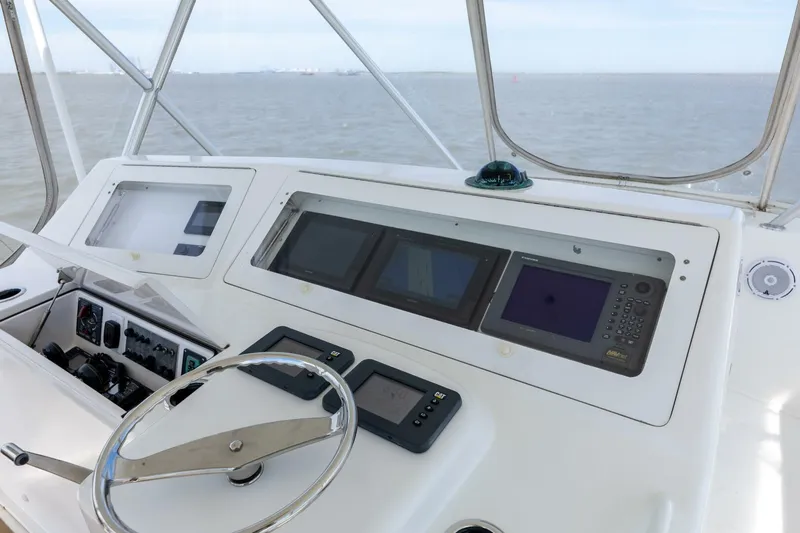 Beer-a-cuda Yacht Photos Pics 2005 Viking 48 Convertible yacht helm with navigation instruments and ocean view.