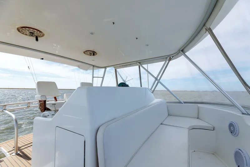 Beer-a-cuda Yacht Photos Pics 2005 Viking 48 Convertible yacht interior with white seating and ocean view.