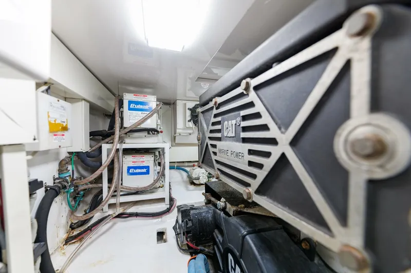 Beer-a-cuda Yacht Photos Pics Engine room of 2005 Viking 48 Convertible yacht with CAT marine power and batteries.