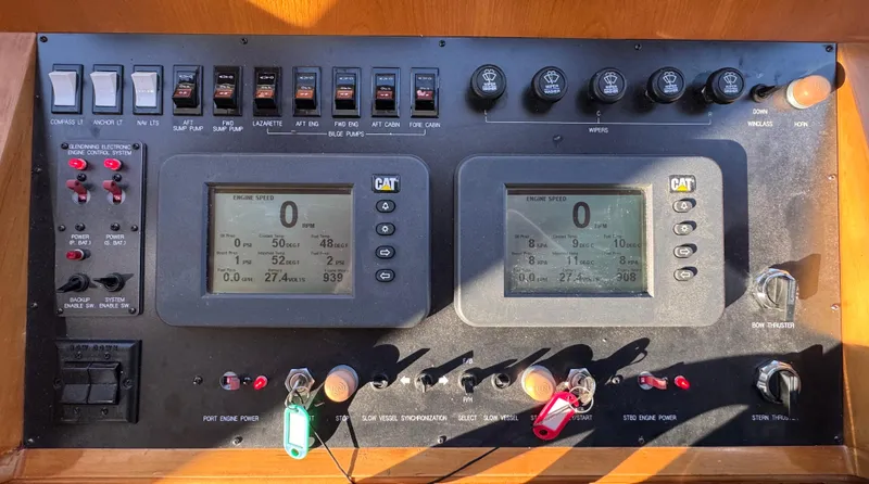 Mariner Yacht Photos Pics Control panel of a 2006 President 63 Pilot House yacht with dual CAT displays.
