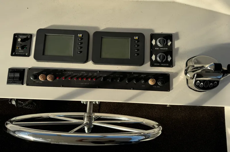 Mariner Yacht Photos Pics Control panel of a 2006 President 63 Pilot House yacht with navigation instruments.