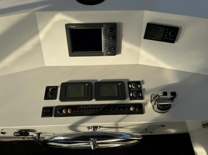 Mariner Yacht Photos Pics Control panel of a 2006 President 63 Pilot House yacht with navigation equipment.