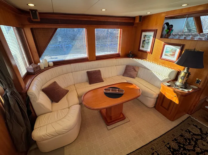 Mariner Yacht Photos Pics Luxurious interior of a 2006 President 63 Pilot House yacht with elegant seating and decor.