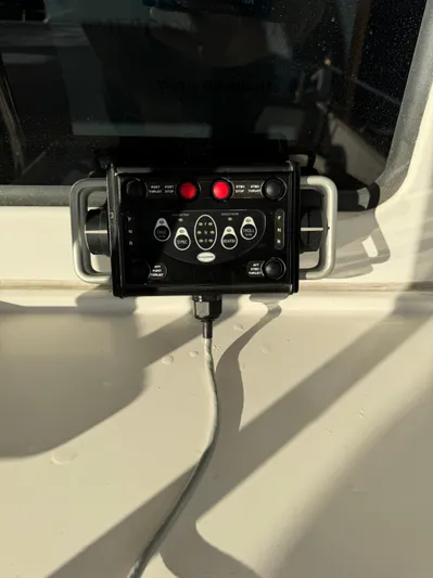 Mariner Yacht Photos Pics Control panel on a 2006 President 63 Pilot House boat, featuring various buttons and dials.