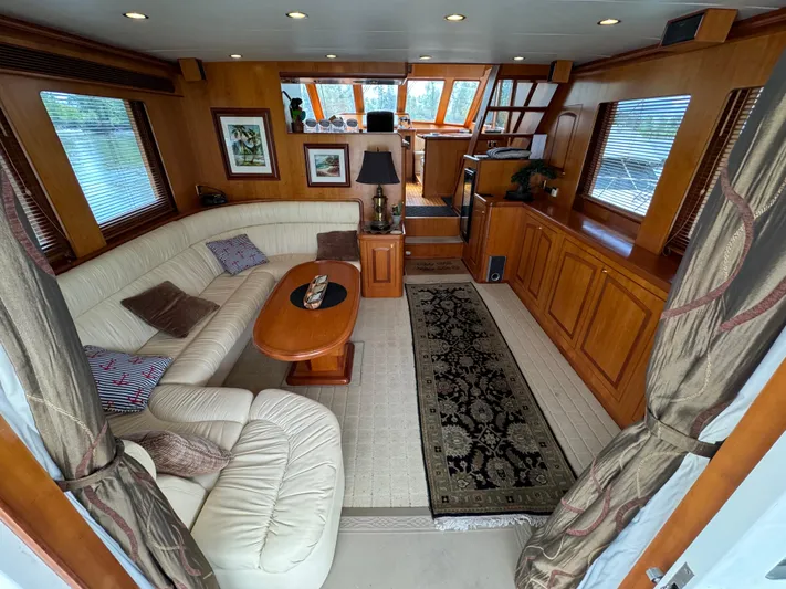 Mariner Yacht Photos Pics Luxurious interior of a 2006 President 63 Pilot House yacht with elegant wood finishes.