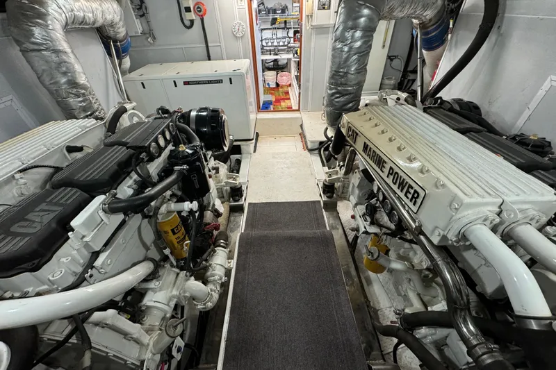 Mariner Yacht Photos Pics Engine room of 2006 President Legend 630 Pilothouse with CAT Marine Power engines.