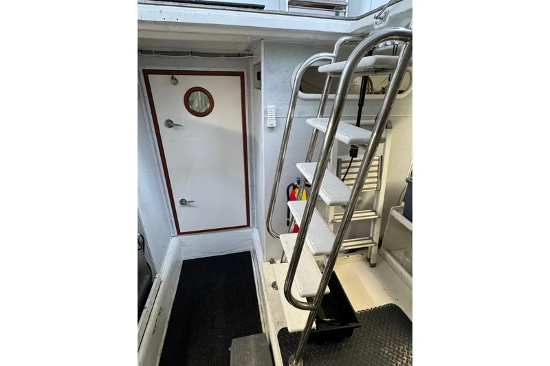 Mariner Yacht Photos Pics Interior of 2006 President Legend 630 Pilothouse with stairs and door.