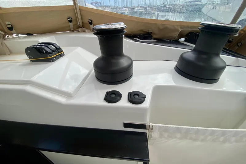  Yacht Photos Pics 2024 Fountaine Pajot Catamaran Aura 51 deck with winches and control panel.
