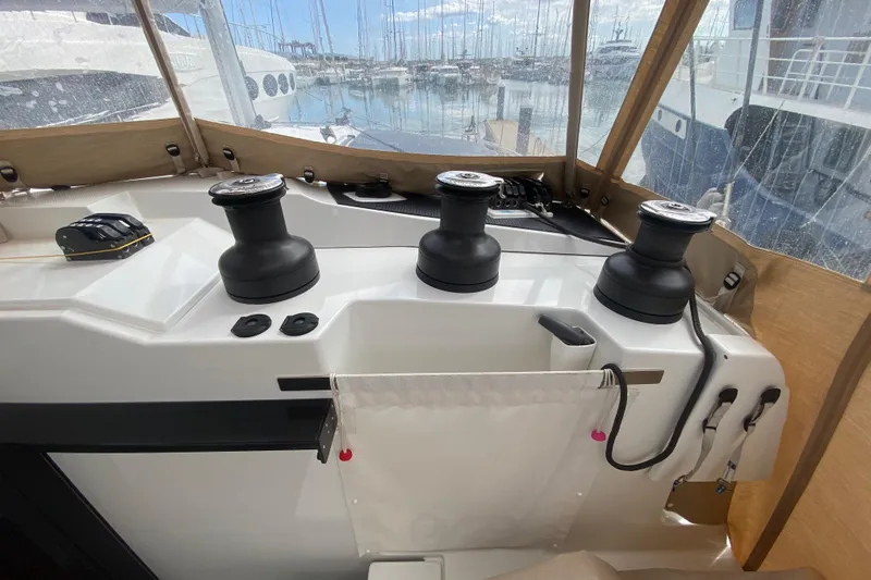  Yacht Photos Pics 2024 Fountaine Pajot Catamaran Aura 51 cockpit with winches and marina view.