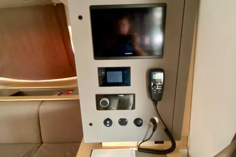 Yacht Photos Pics Control panel inside 2024 Fountaine Pajot Catamaran Aura 51, featuring navigation and communication equipment.