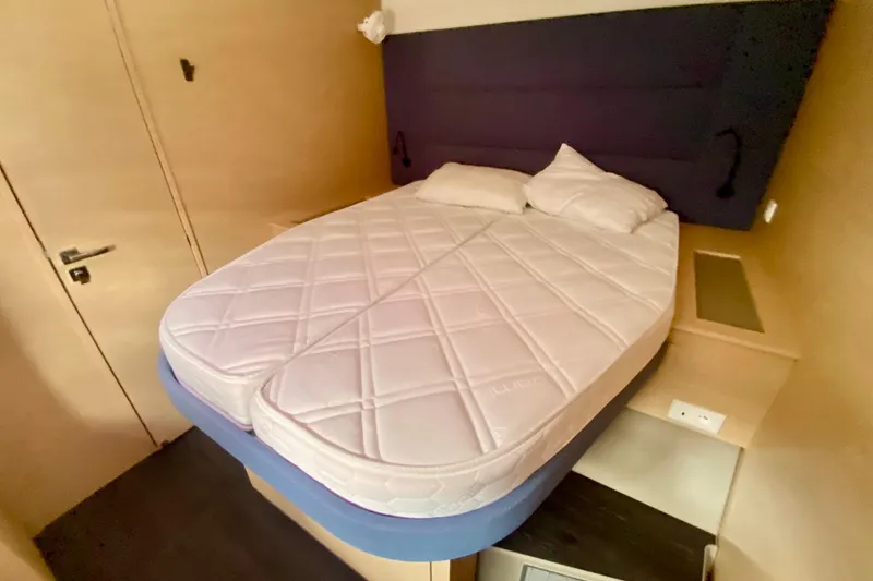  Yacht Photos Pics 2024 Fountaine Pajot Catamaran Aura 51 cabin with bed and pillows.