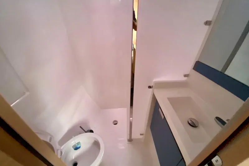  Yacht Photos Pics 2024 Fountaine Pajot Catamaran Aura 51 bathroom with modern sink and shower.