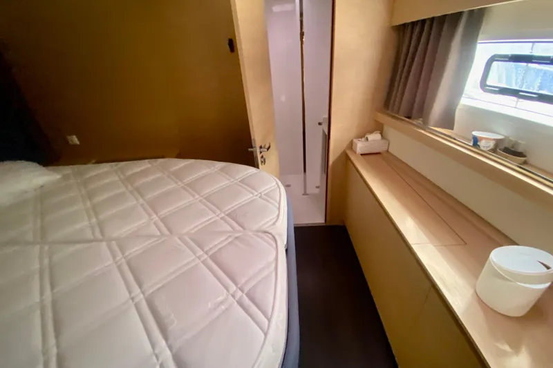  Yacht Photos Pics 2024 Fountaine Pajot Catamaran Aura 51 cabin interior with bed and window view.