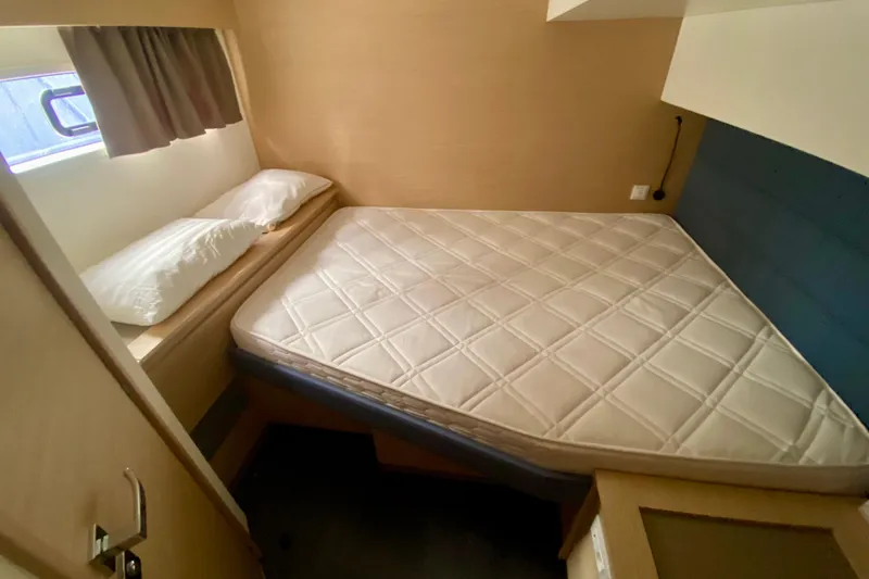  Yacht Photos Pics 2024 Fountaine Pajot Catamaran Aura 51 cabin with bed and window view.