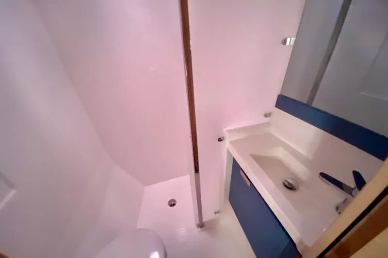  Yacht Photos Pics 2024 Fountaine Pajot Catamaran Aura 51 bathroom with modern sink and shower.