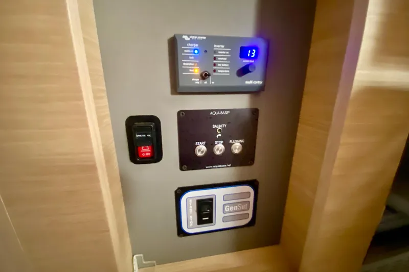  Yacht Photos Pics Control panel of 2024 Fountaine Pajot Catamaran Aura 51, featuring various switches and indicators.