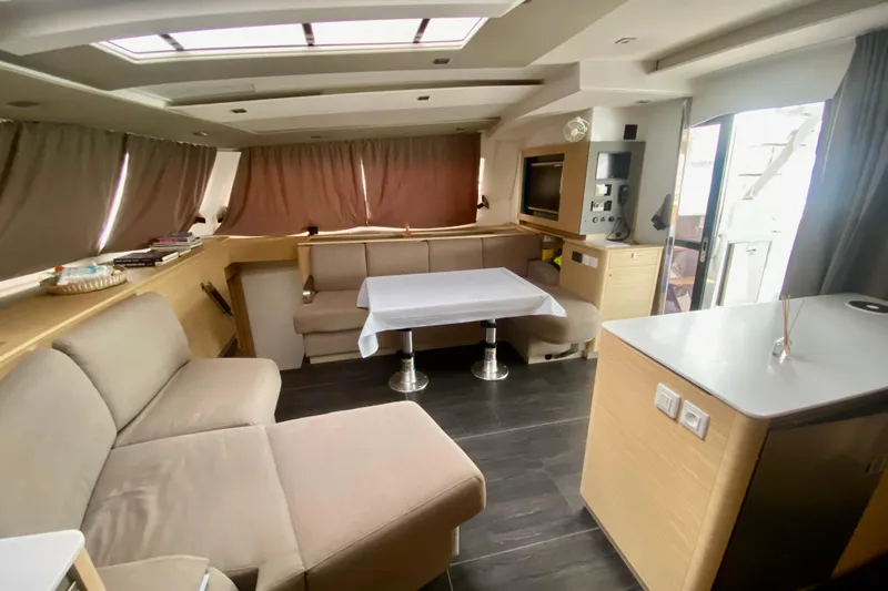  Yacht Photos Pics Luxurious interior of 2024 Fountaine Pajot Catamaran Aura 51 with modern furnishings.