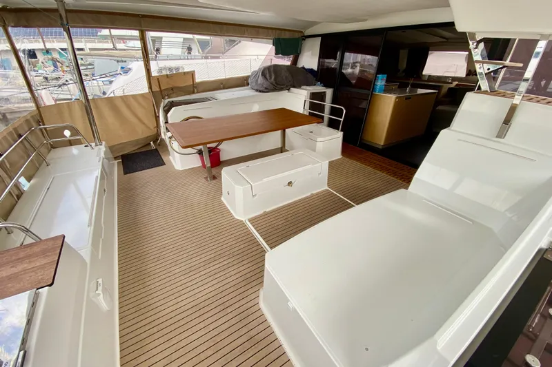  Yacht Photos Pics 2024 Fountaine Pajot Catamaran Aura 51 interior with spacious seating and modern design.