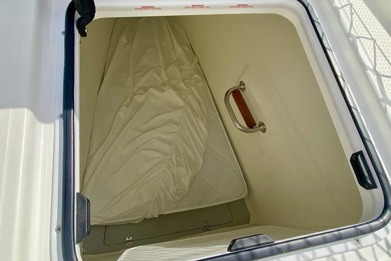  Yacht Photos Pics 2024 Fountaine Pajot Catamaran Aura 51 storage compartment with handle and cushion.