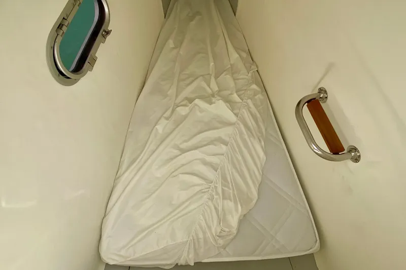  Yacht Photos Pics 2024 Fountaine Pajot Catamaran Aura 51 cabin with mattress and porthole.