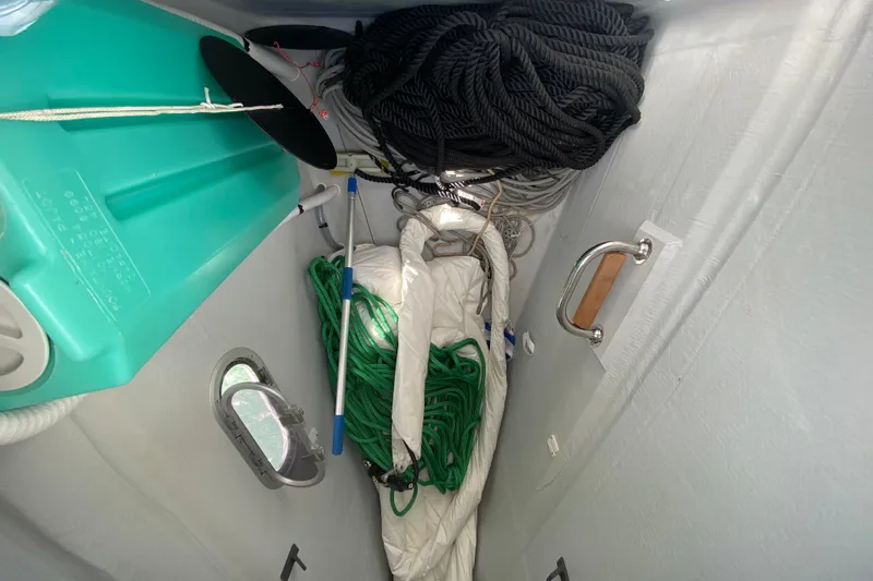  Yacht Photos Pics Storage compartment in 2024 Fountaine Pajot Catamaran Aura 51 with ropes and equipment.