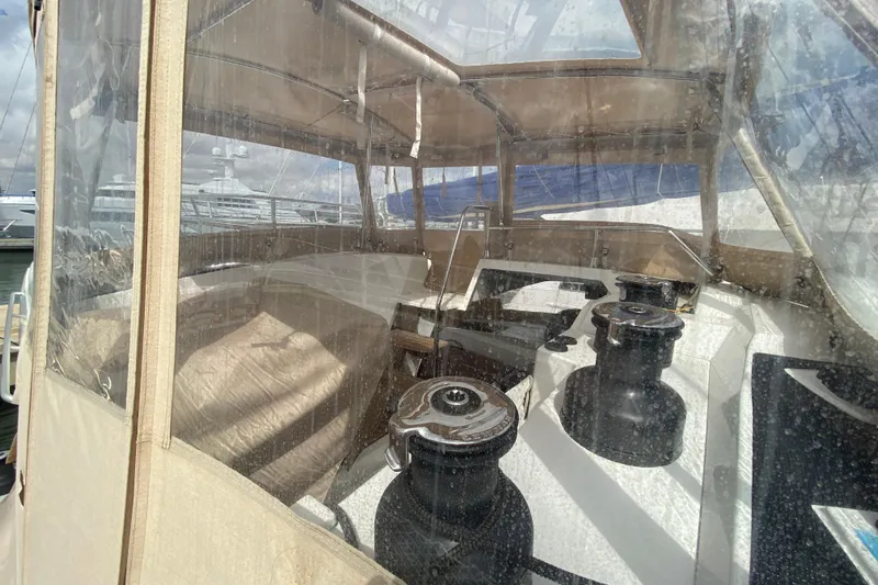  Yacht Photos Pics 2024 Fountaine Pajot Catamaran Aura 51 cockpit with winches and protective canopy.