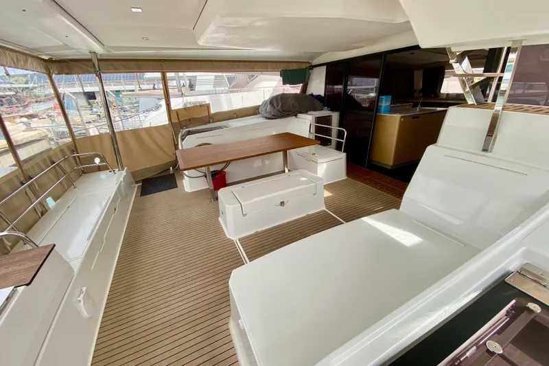  Yacht Photos Pics Luxurious 2024 Fountaine Pajot Aura 51 catamaran interior with spacious seating and modern design.