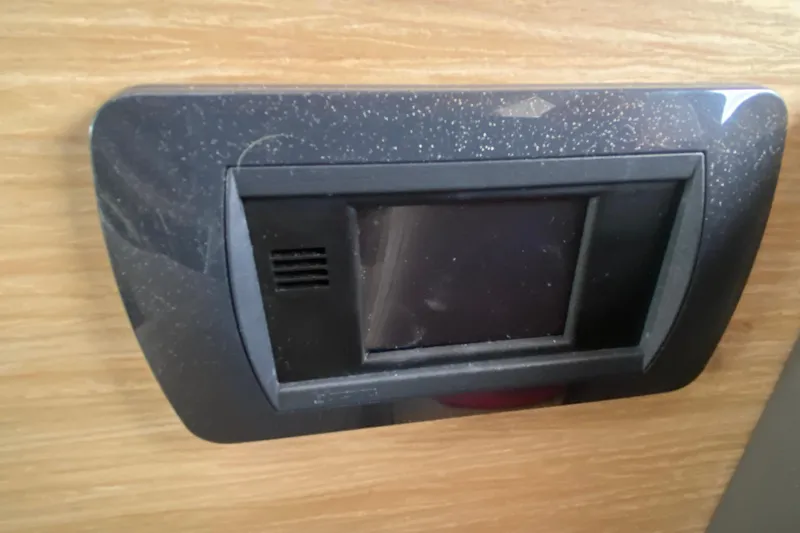  Yacht Photos Pics Control panel on 2024 Fountaine Pajot Catamaran Aura 51, mounted on wooden surface.