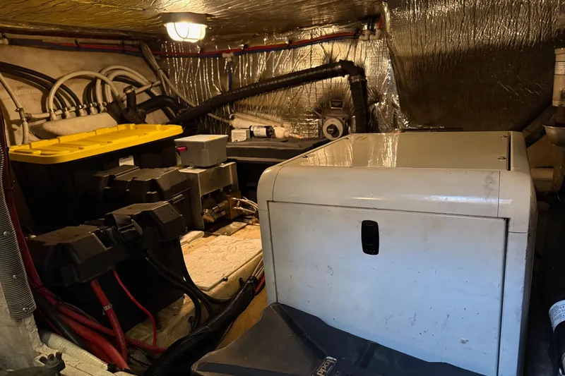 Cavu Yacht Photos Pics Engine room of 2001 Cruisers 4450 ACMY yacht with equipment and wiring.